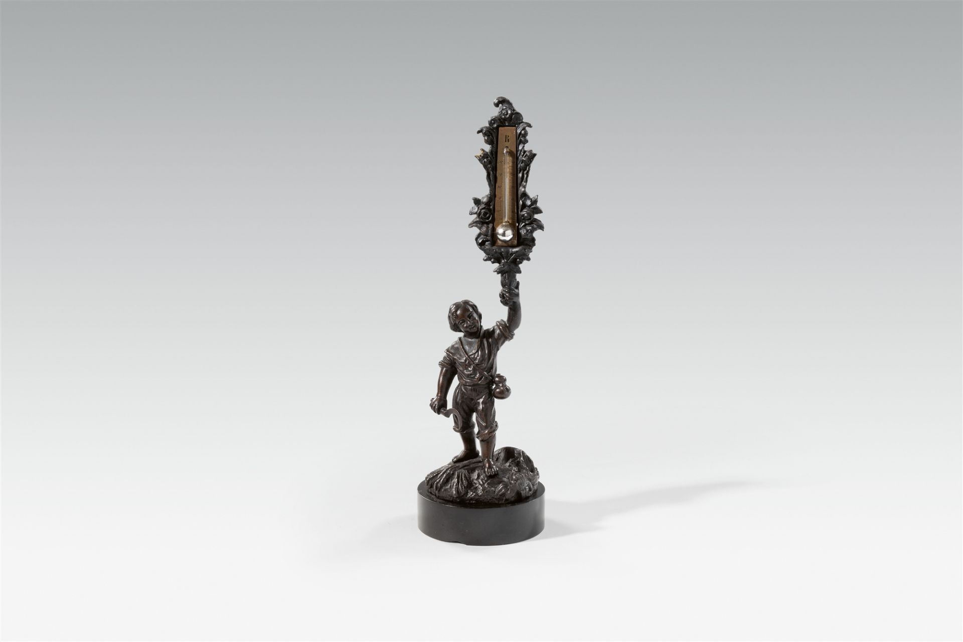 A French cast iron figure of a boy with a thermometer