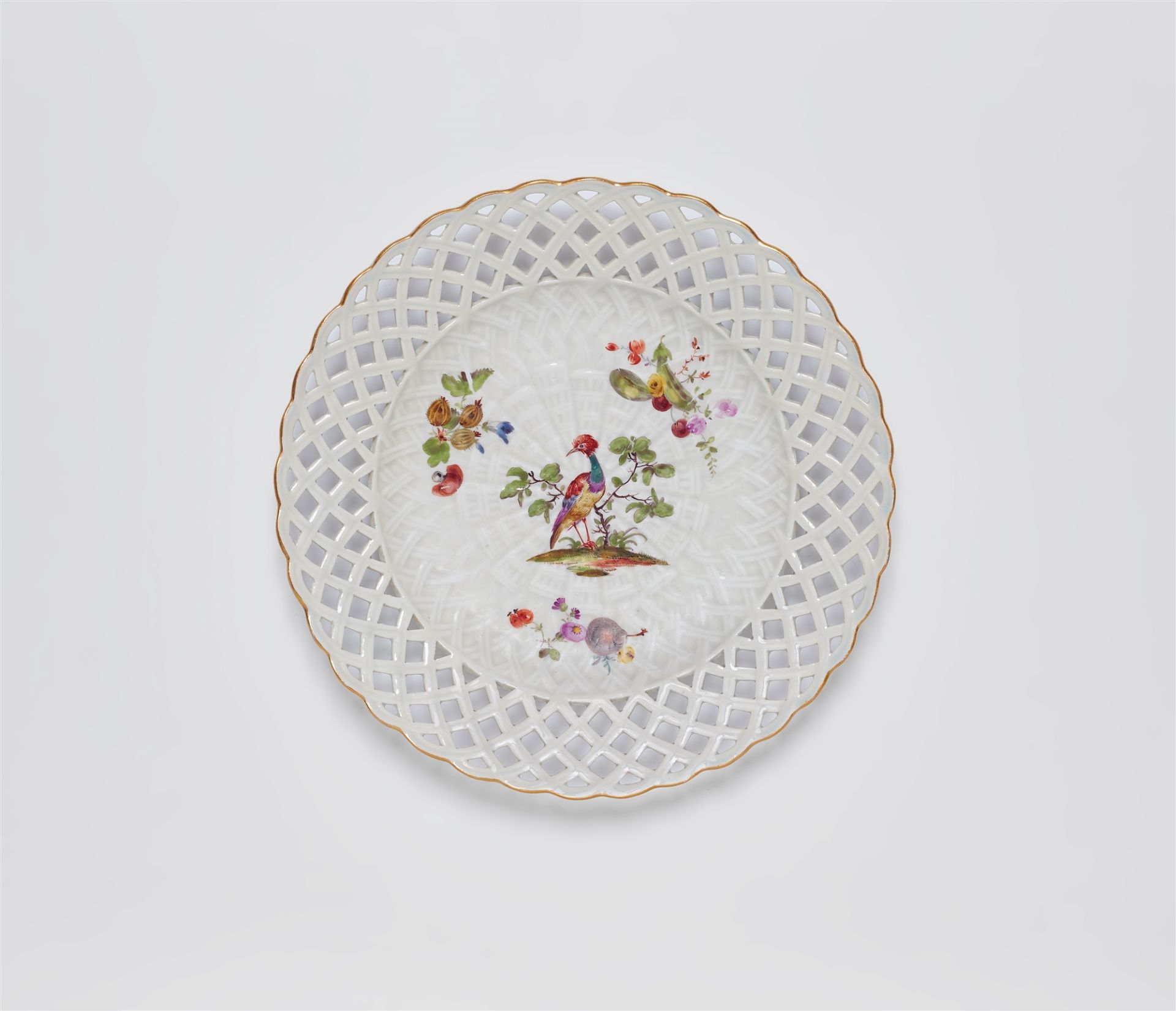 A Meissen porcelain pierced dessert plate from a service for King Frederick II with Indian birds, fr