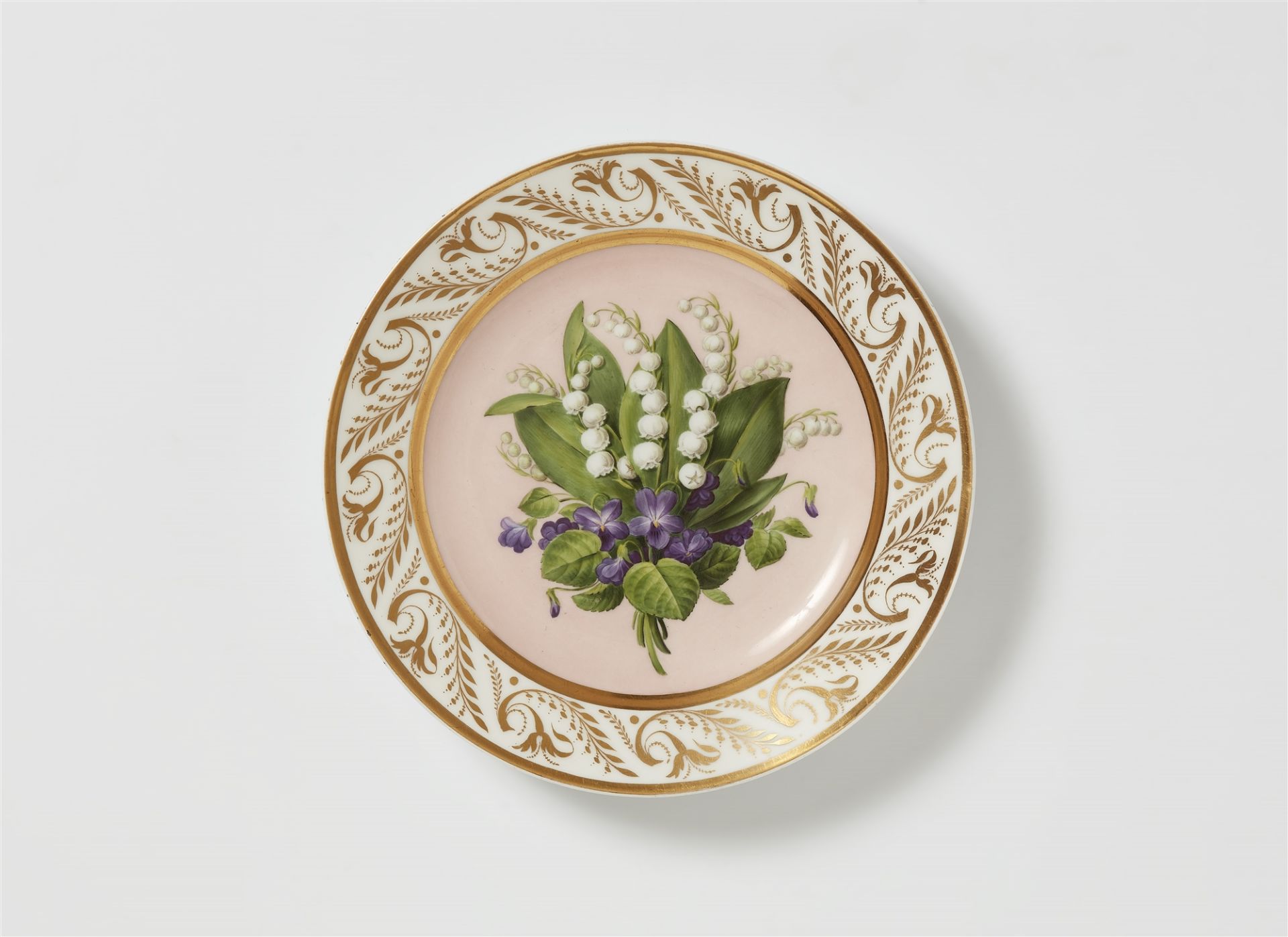 A Berlin KPM porcelain plate with botanical decor