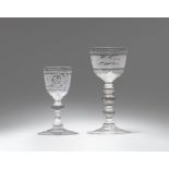 Two cut glass goblets with layered shafts