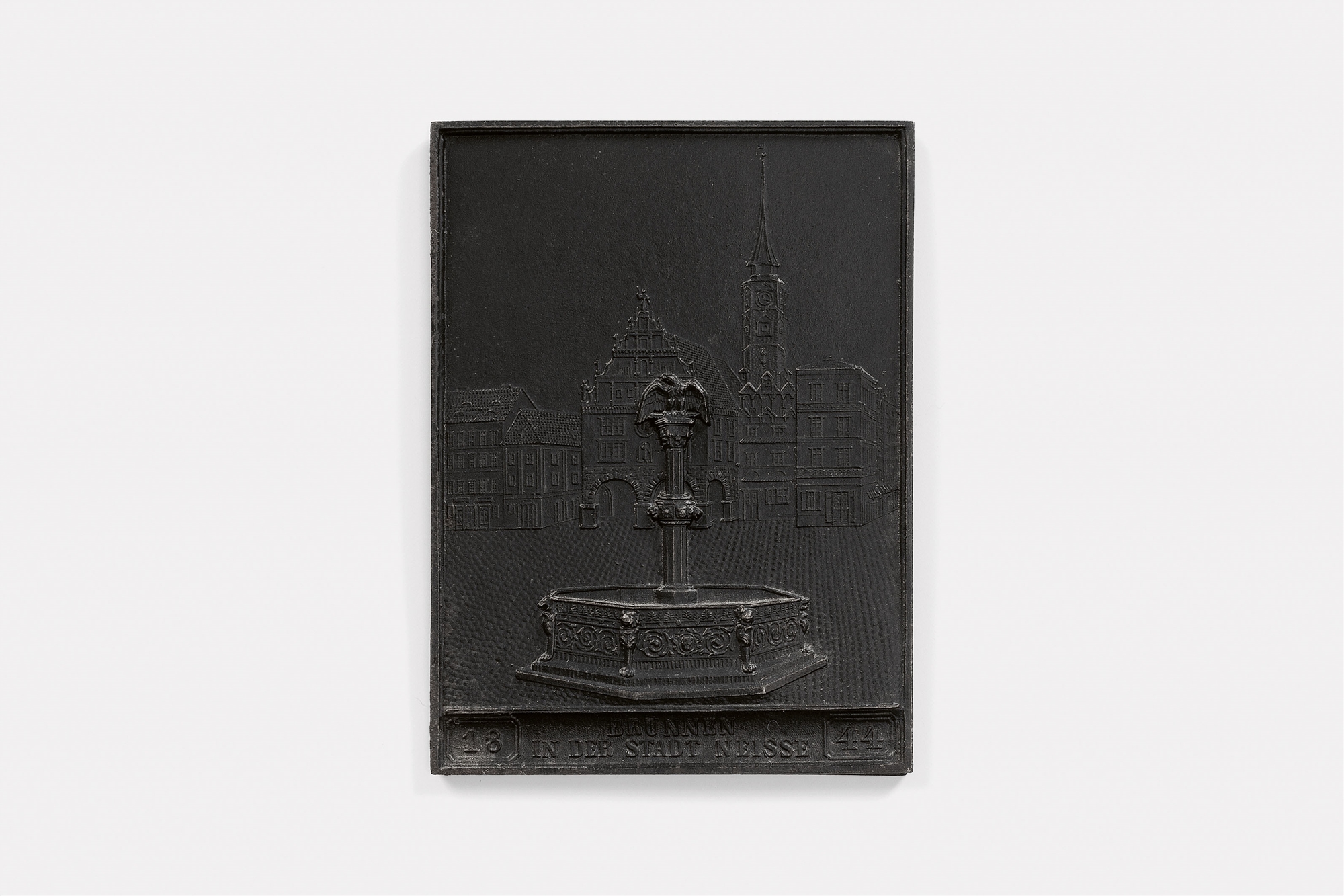 A cast iron New Year's plaque inscribed "1844 BRUNNEN IN DER STADT NEISSE"