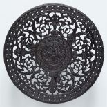 A cast iron stembowl with arabesque decor