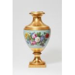 A Berlin KPM porcelain "Munich" vase with flowers and fruit