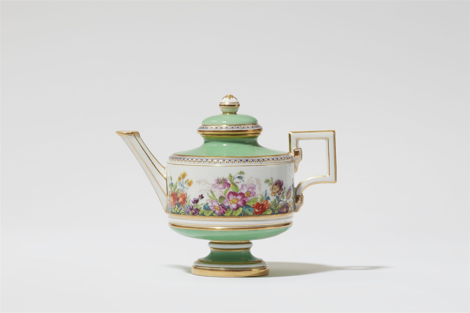 A Berlin KPM porcelain teapot with "fleurs en terrasse"