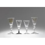Four Saxon glass goblets with monograms