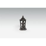 A cast iron incense holder and cover