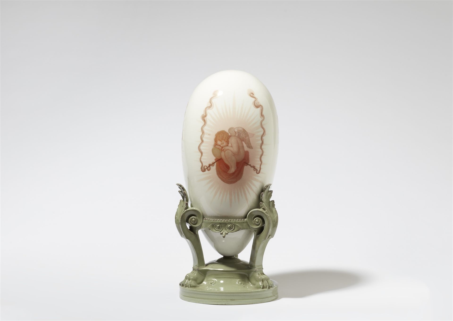 A decorative Sèvres porcelain egg