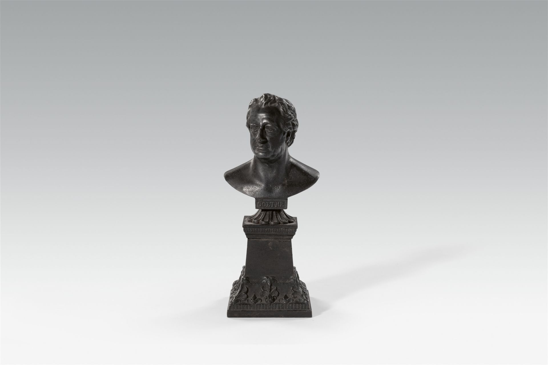 A cast iron bust of Goethe on a plinth