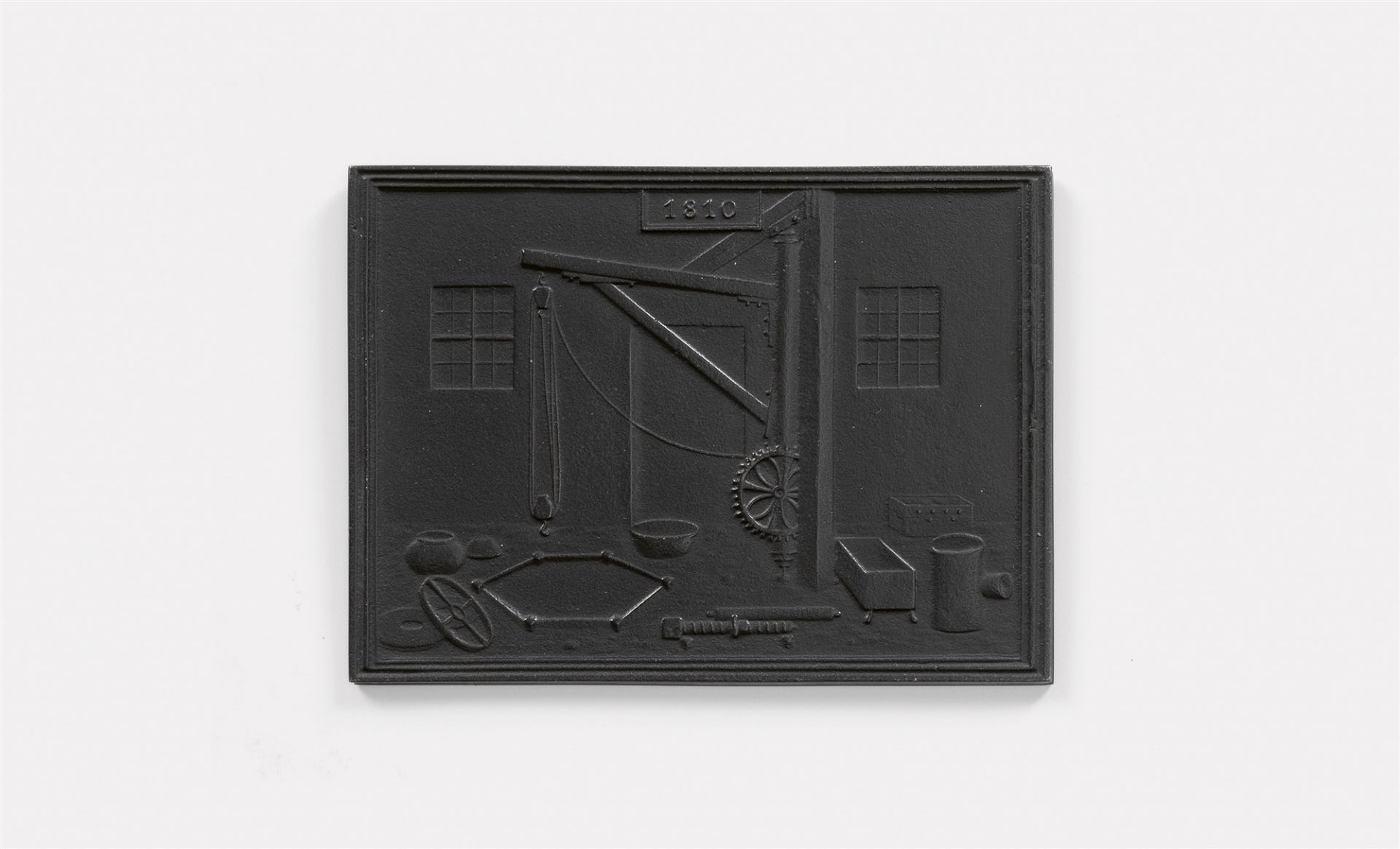 A cast iron New Year's plaque inscribed "1810"