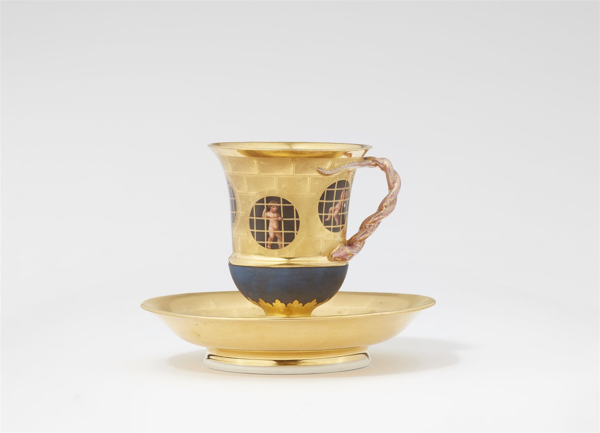 A Berlin KPM porcelain cup and saucer with putti behind bars - Image 2 of 2