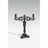 A cast iron candlestick