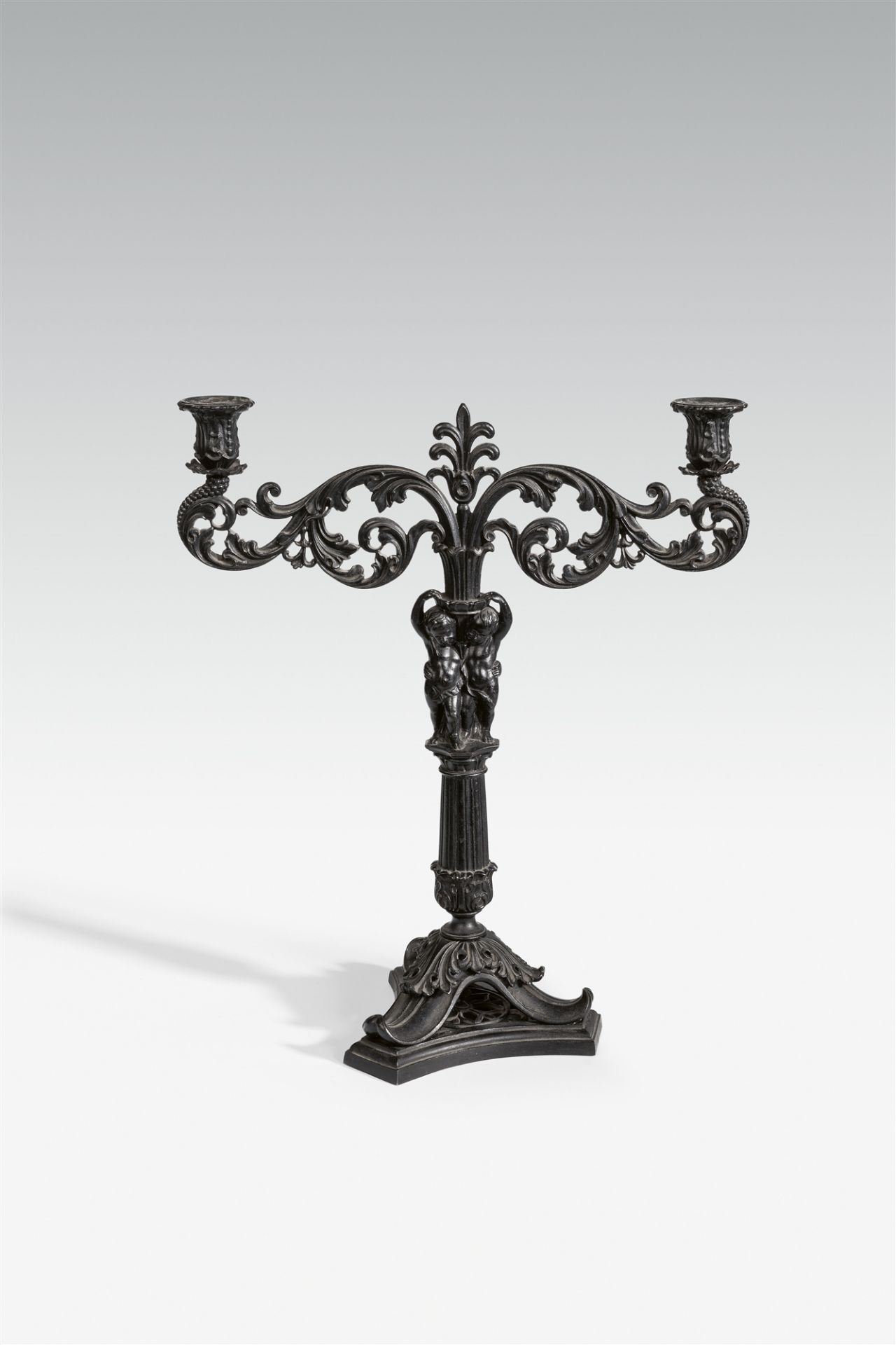 A cast iron candlestick