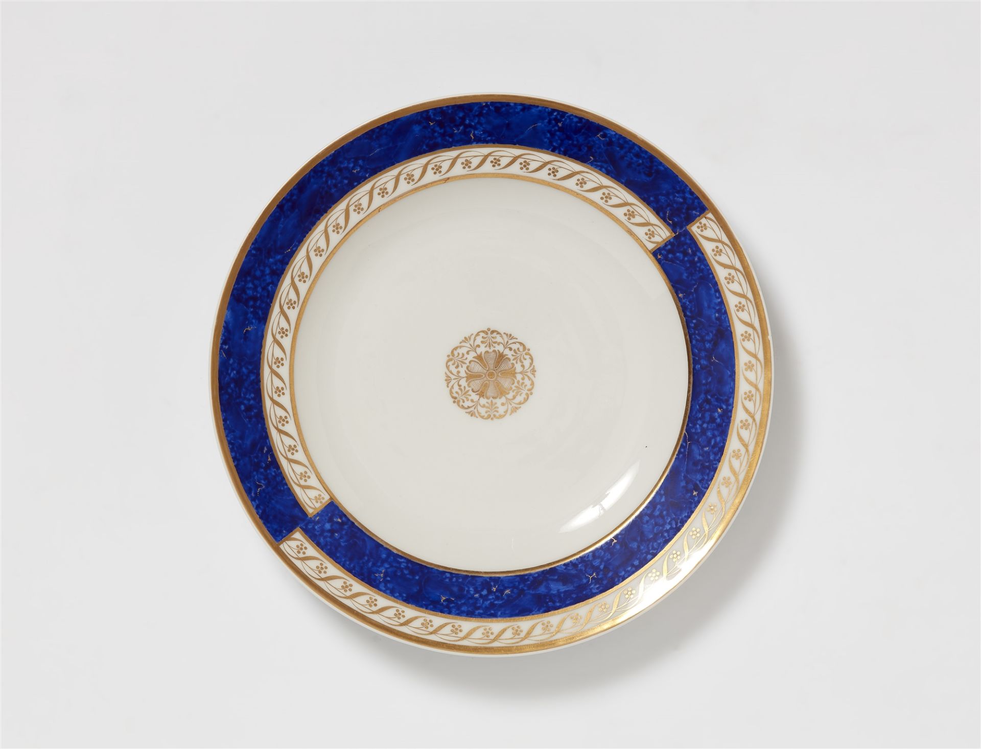 A Berlin KPM porcelain plate with various decor designs