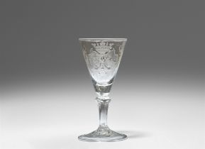 A cut glass goblet with an arms of alliance