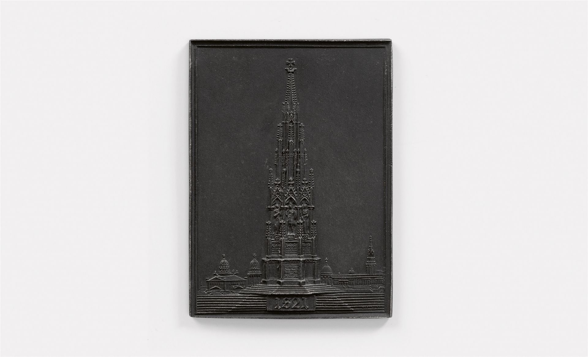 A cast iron New Year's plaque inscribed "1821" with the Kreuzberg memorial