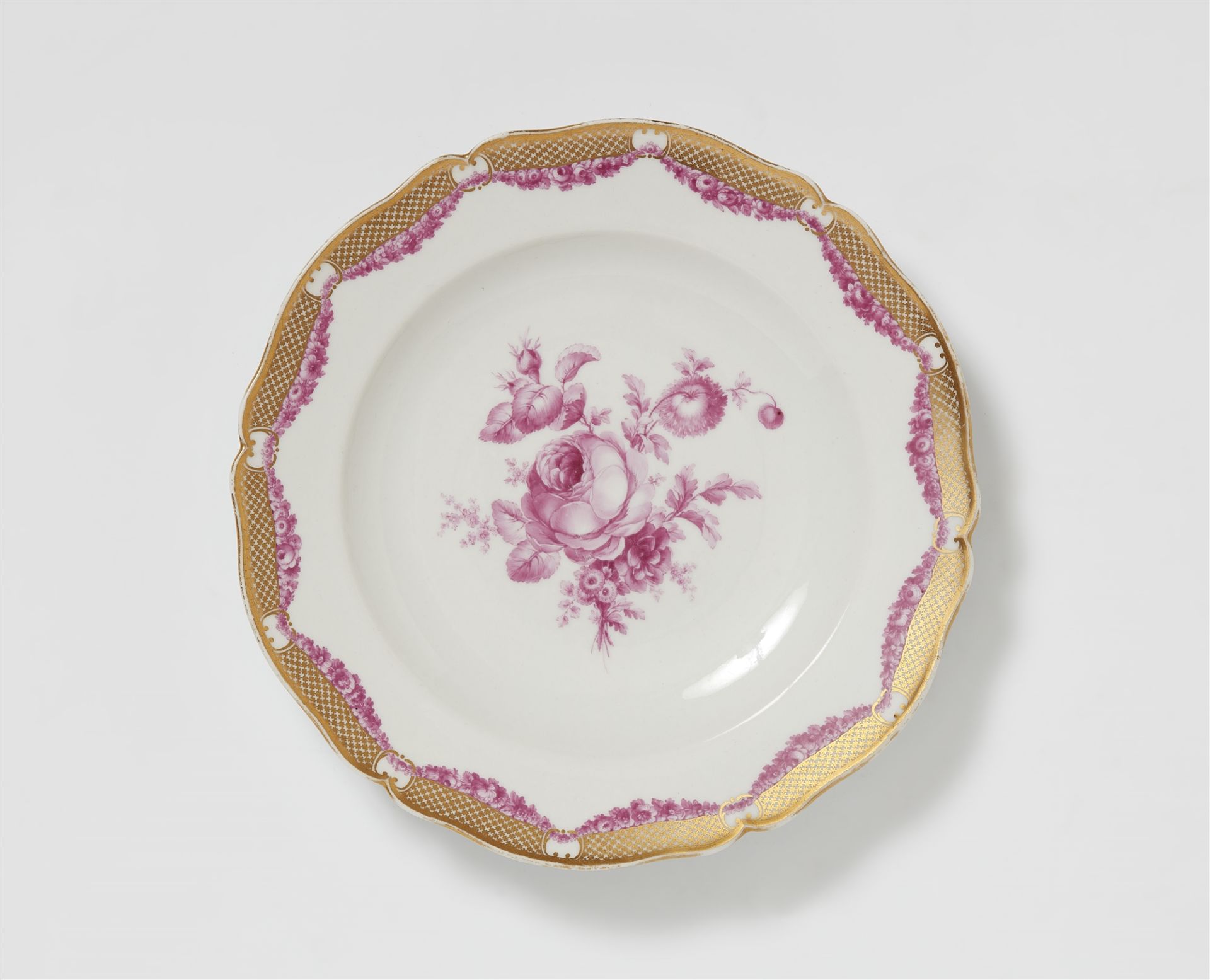 A Berlin KPM porcelain plate from the royal dinner service with purple flowers