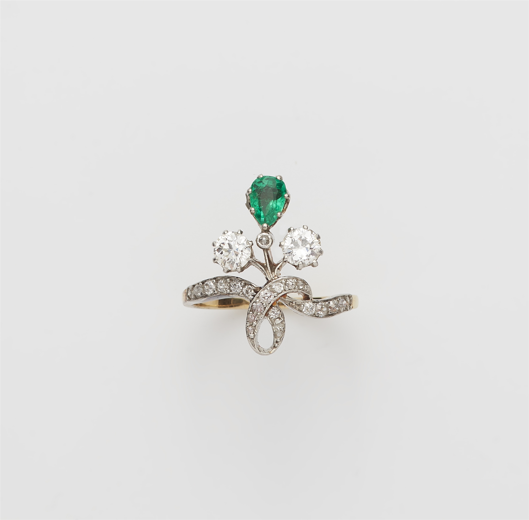A Belle Epoque 18k gold diamond and emerald ring.