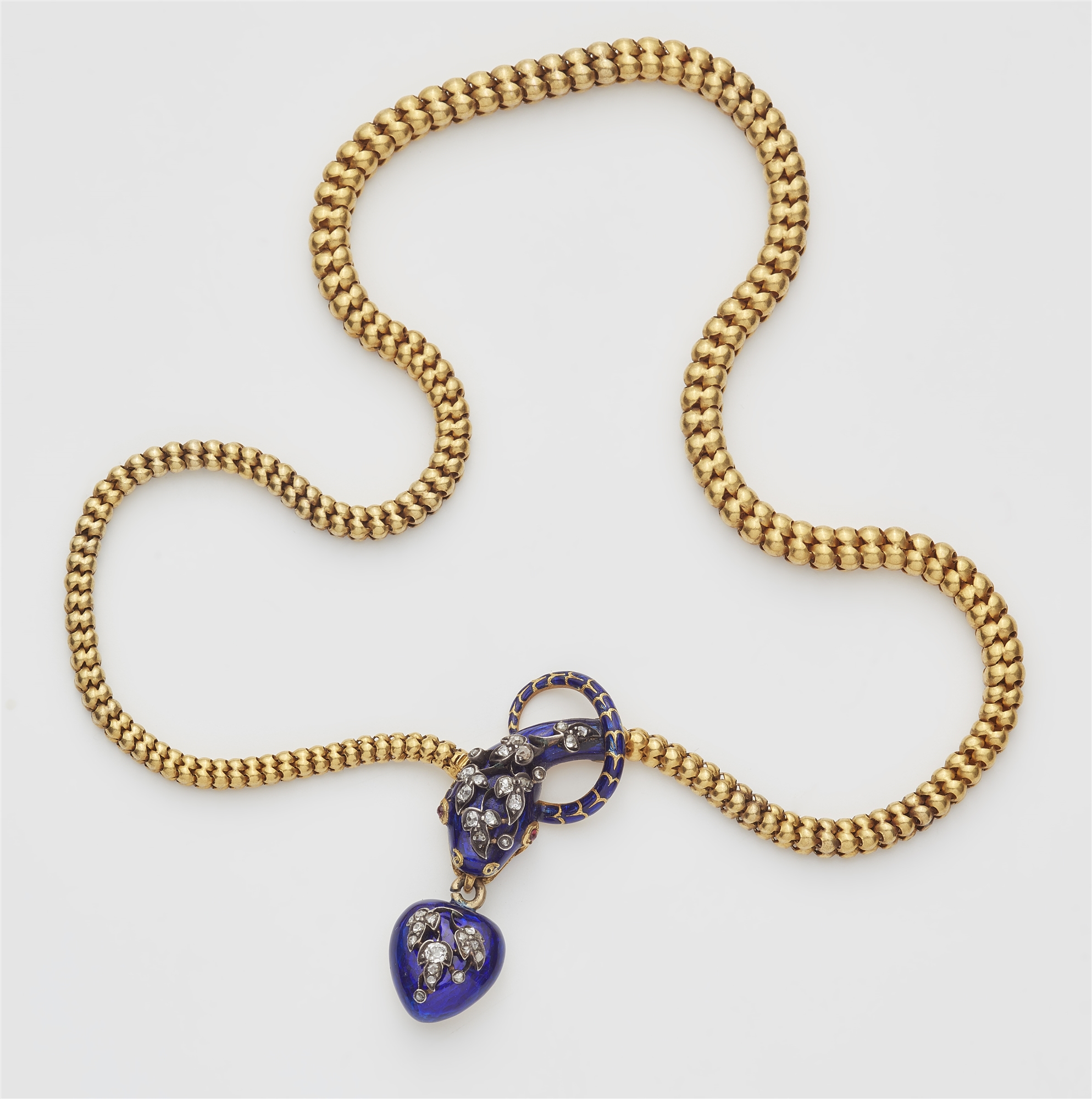 A Victorian flexible 18k gold tubogaz blue enamel and diamond necklace with snake head and heart loc