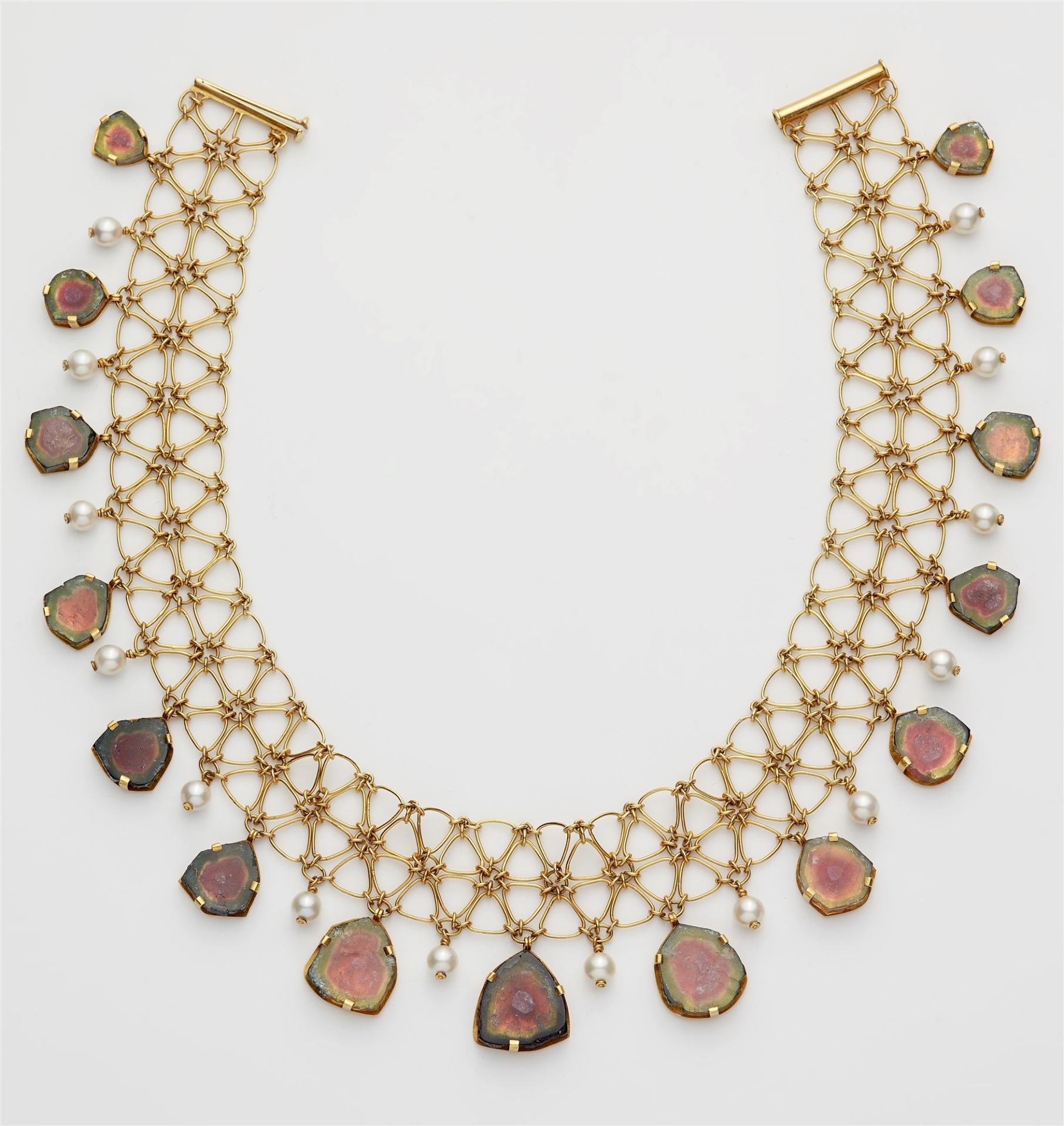 An 18k gold wire watermelon tourmaline and pearl fringe necklace.