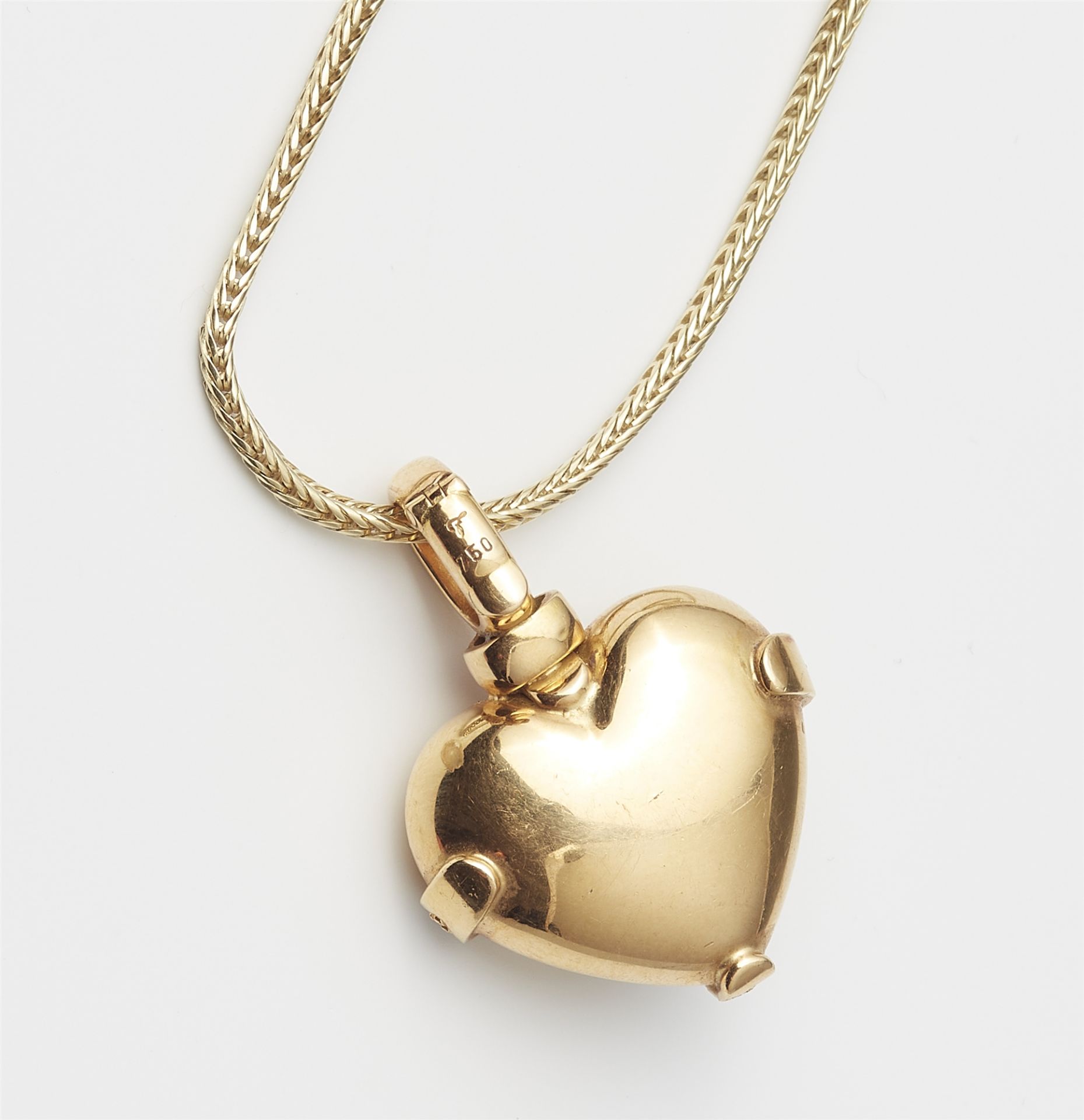 An 18k gold diamond and ruby cabochon heart pendant with enclosed 14k gold chain. - Image 2 of 2