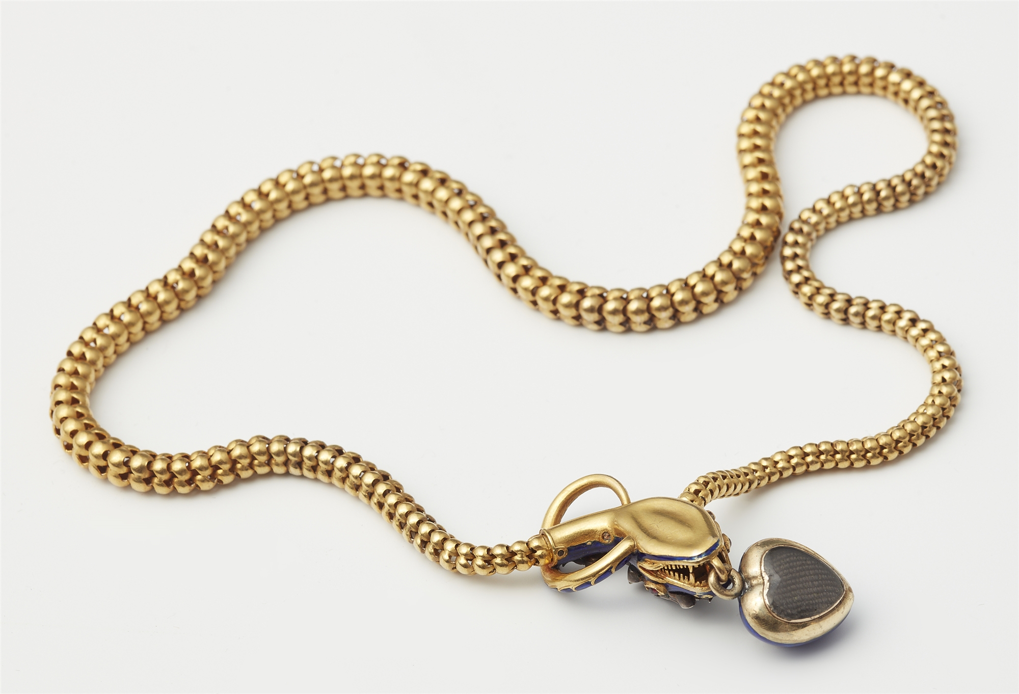 A Victorian flexible 18k gold tubogaz blue enamel and diamond necklace with snake head and heart loc - Image 2 of 2