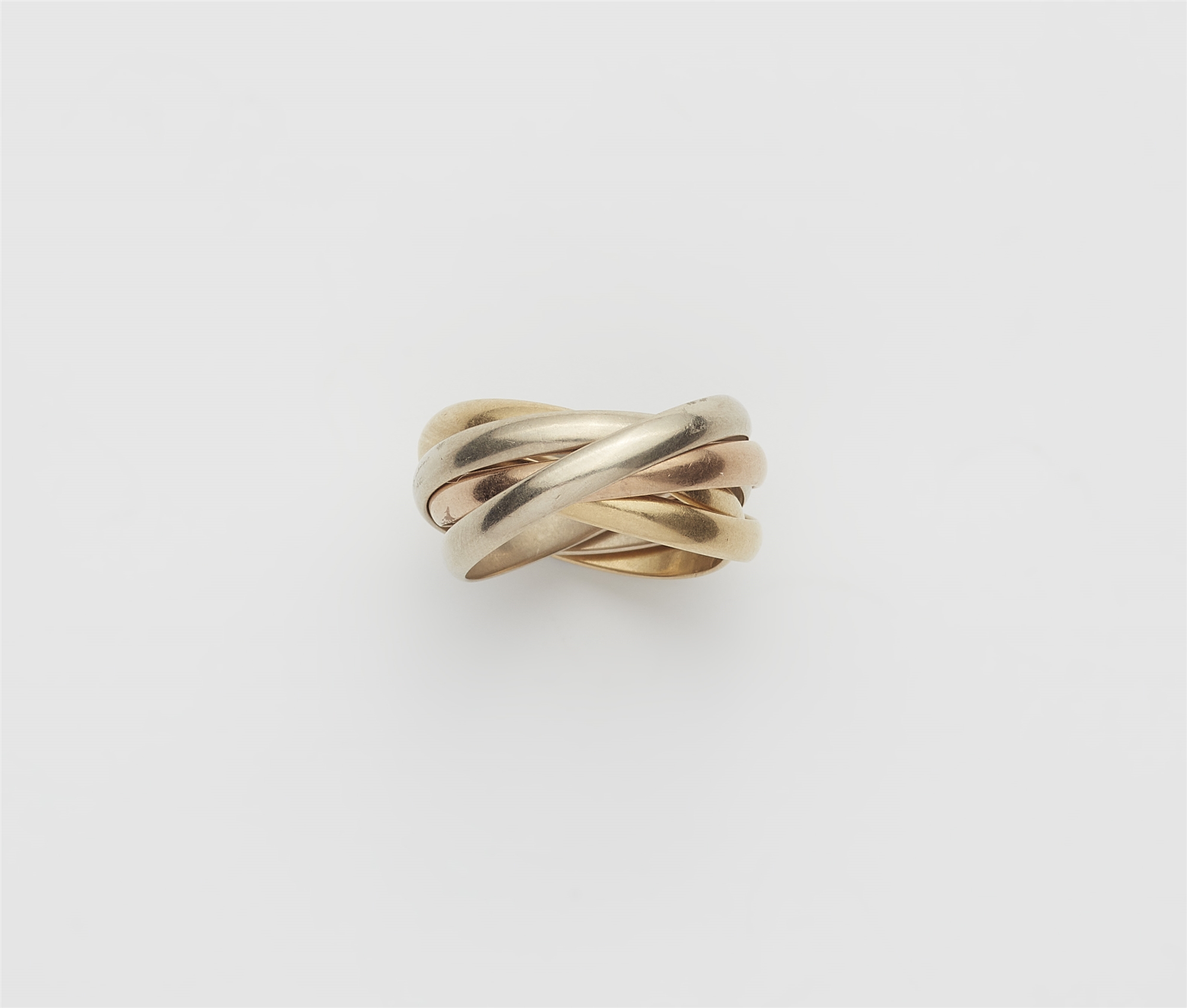 A five band 18 kt gold Trinity ring.