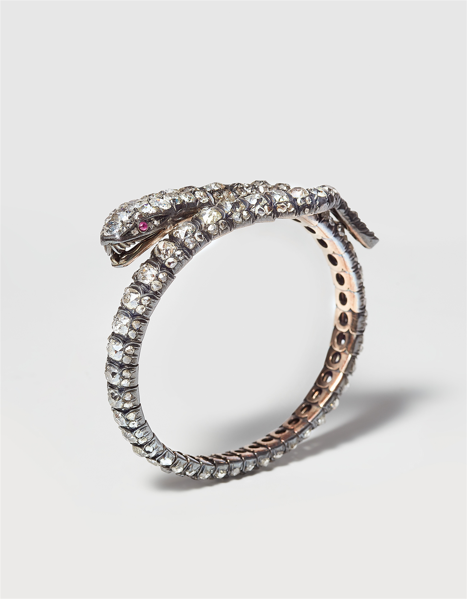 A Victorian 14k gold silver and European old-cut diamond snake bangle.