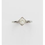 A platinum and European old-cut diamond solitaire ring.