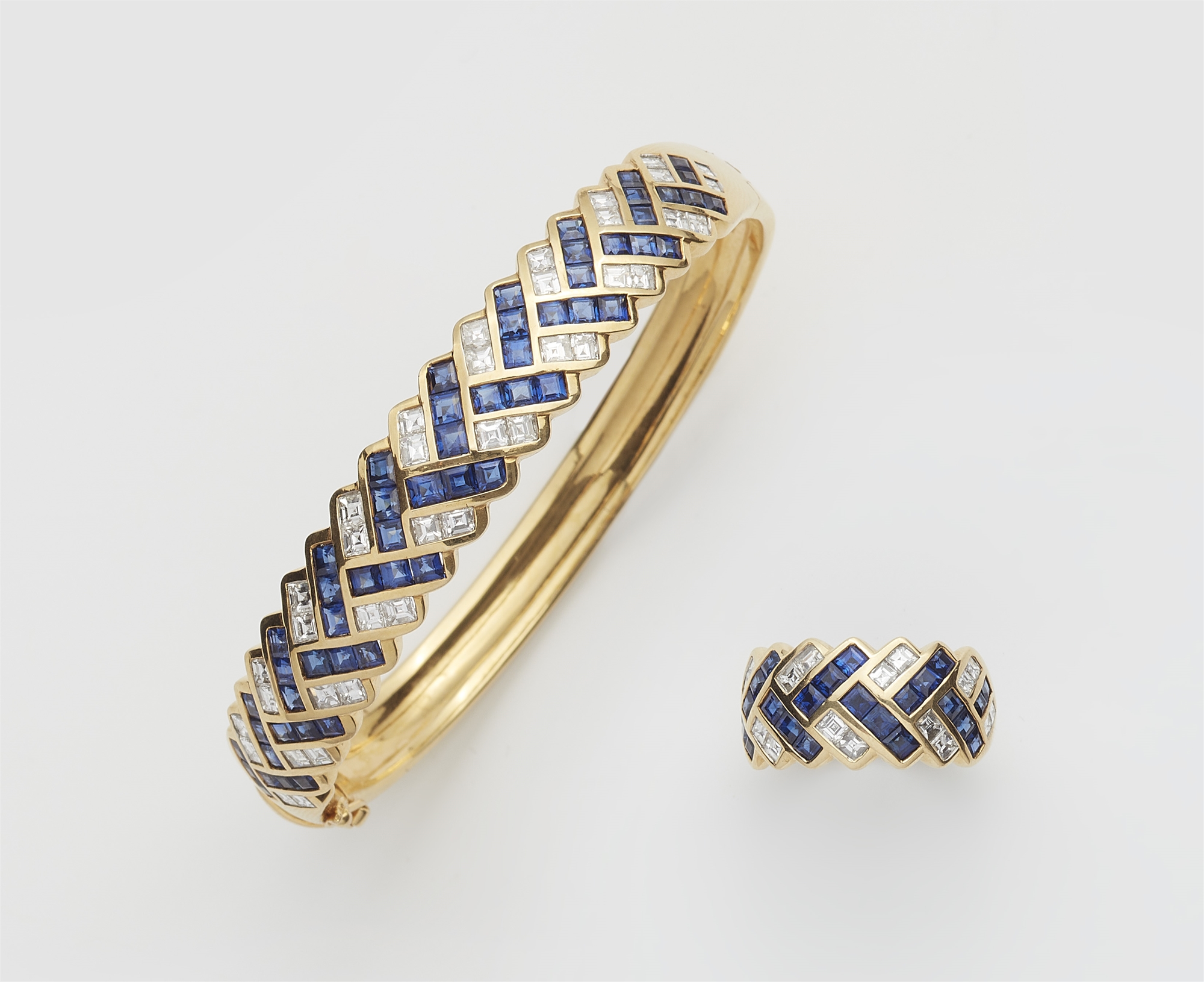 A German 18k gold sapphire and diamond bangle and ring.