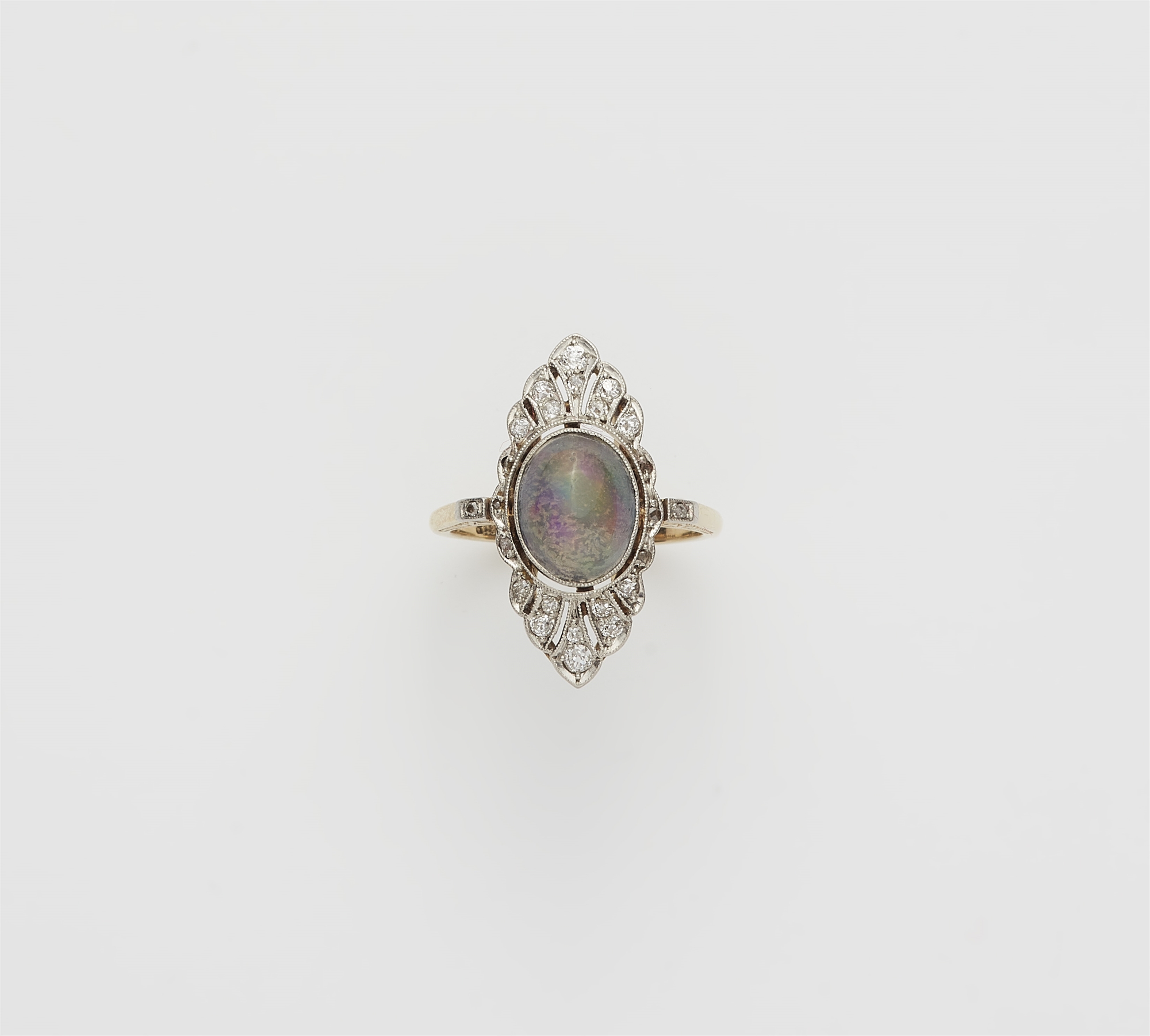 A Belle Epoque 14k gold platinum diamond and opal cabochon Marquise ring.