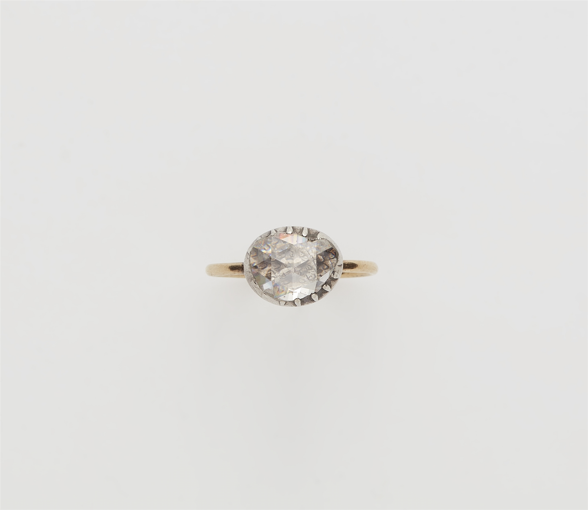 A George III 14k gold silver and rose-cut diamond solitaire ring.