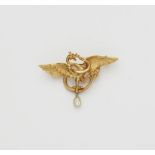An Art Nouveau 18k gold griffon brooch with diamond droplet.