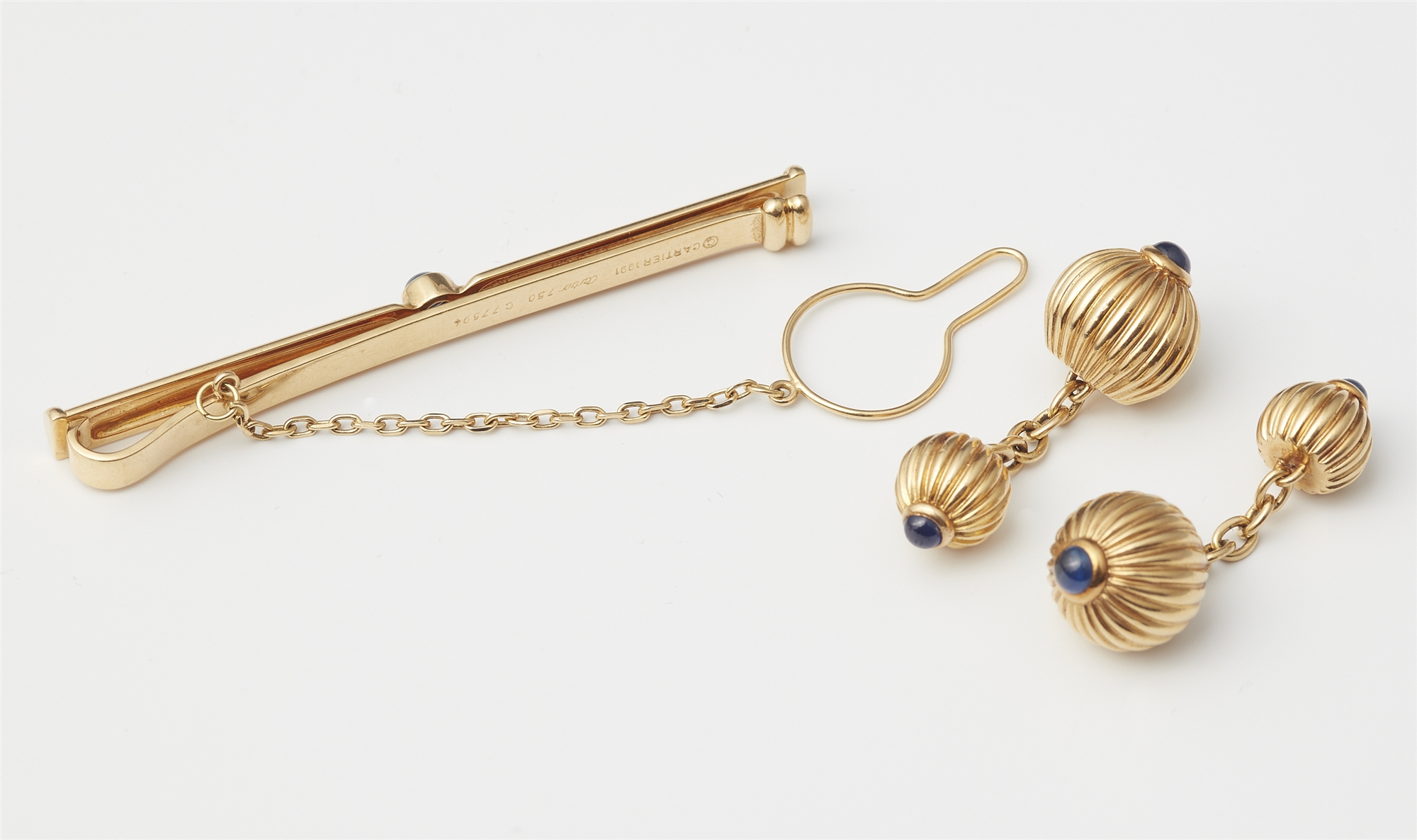 A pair of French godrooned 18k gold and sapphire tie clip and pair of double sided cufflinks. - Image 2 of 2