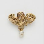 A French Art Nouveau 18k gold, diamond ruby and pearl pendant brooch.