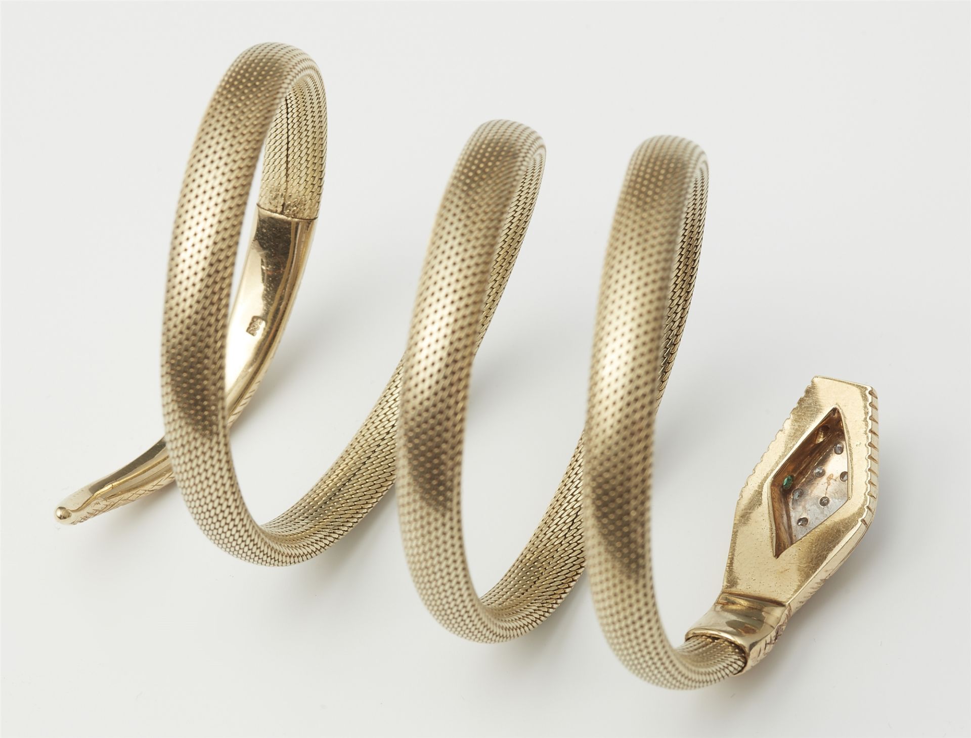 A flexible 14k gold tubogaz snake bracelet with jewelled head. - Image 2 of 2