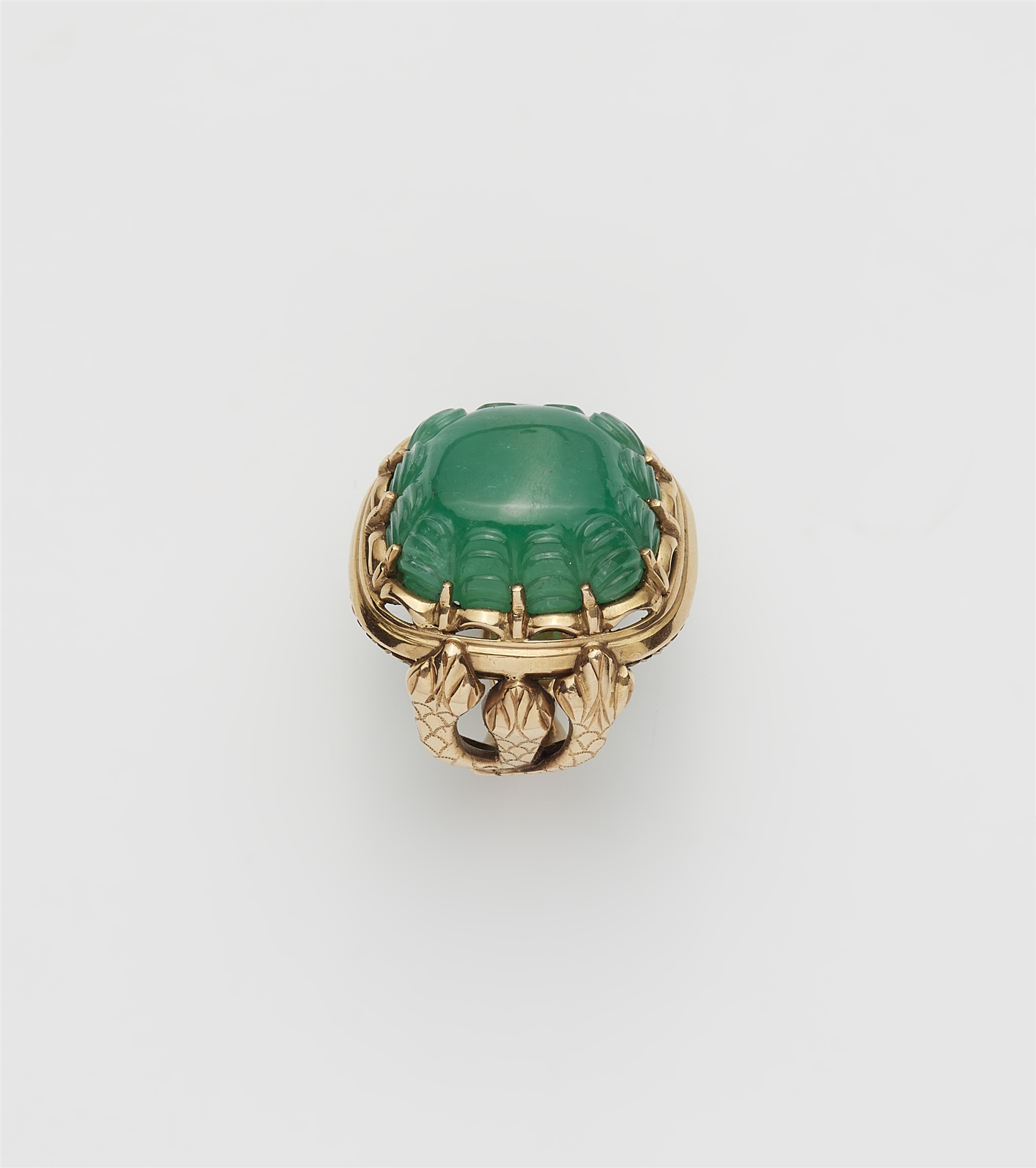 An Italian 18k gold and large carved emerald snake ring.