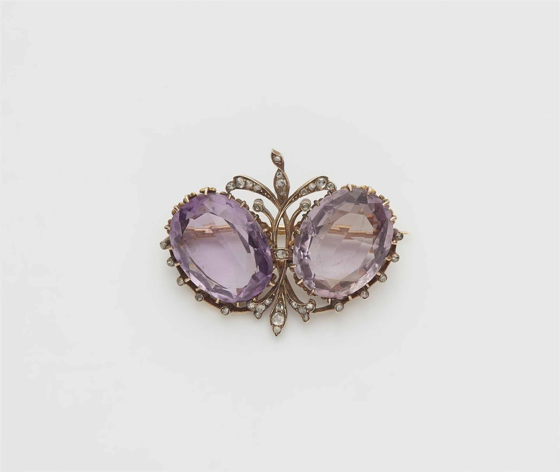 A late 19th century 14k gold, diamond and amethyst brooch.
