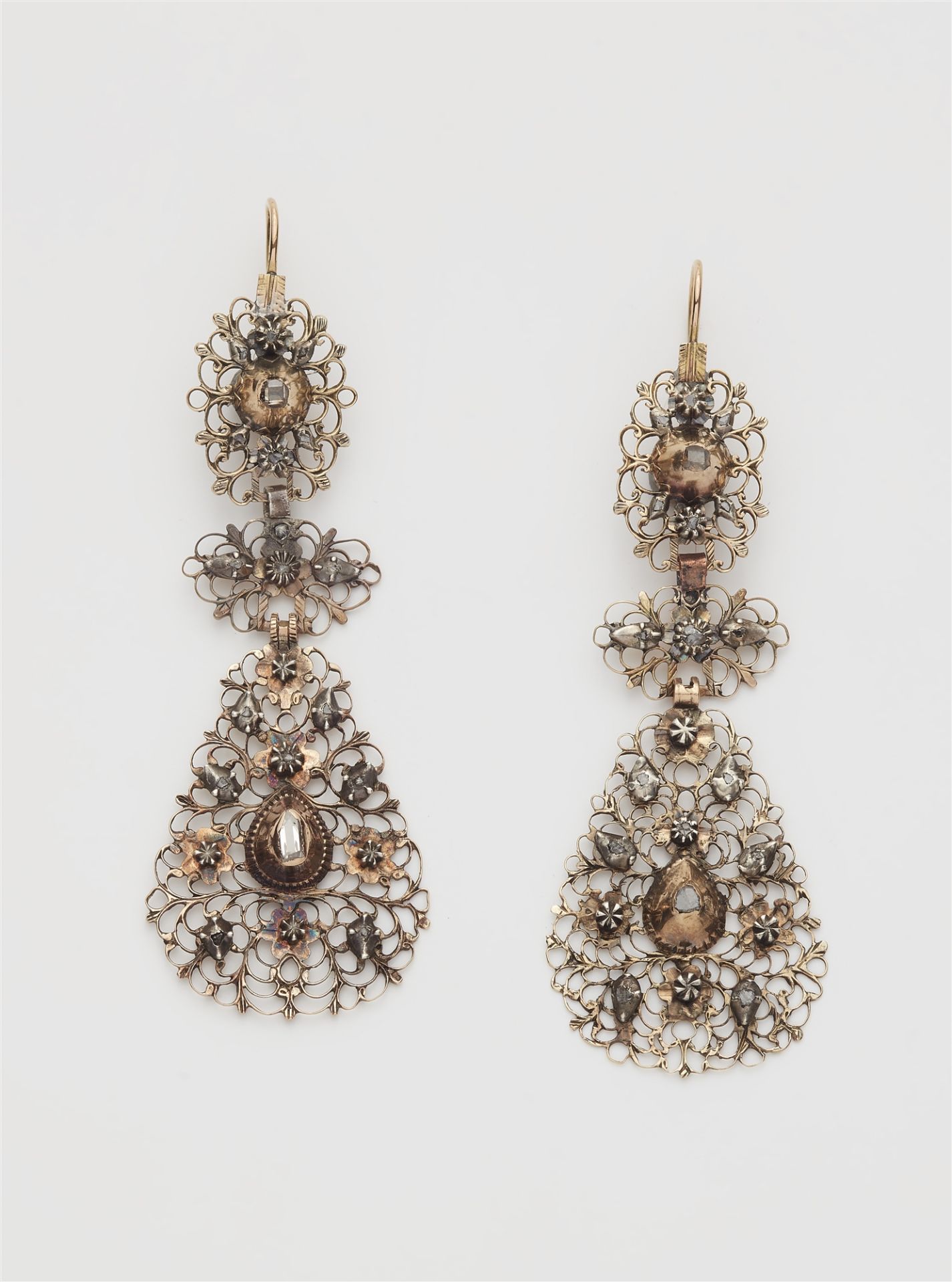 A pair of Flemish red gold filigree silver and diamond Baroque style earrings.