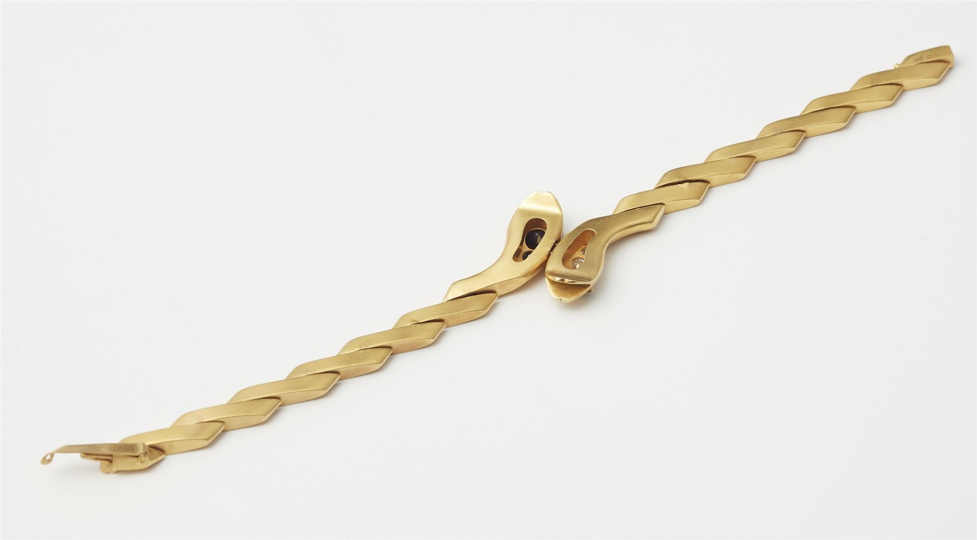 An 18k gold repoussé sapphire and diamond snake bracelet. - Image 2 of 2