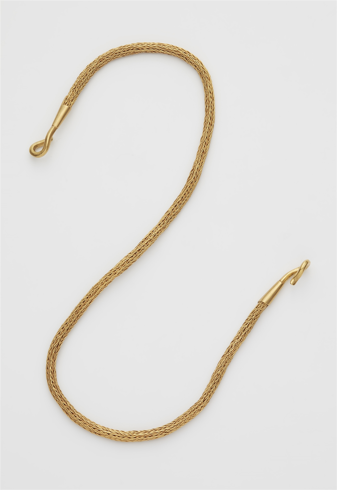 A hand forged 18k gold Ancient Revival tubogaz necklace with foxtail pattern.