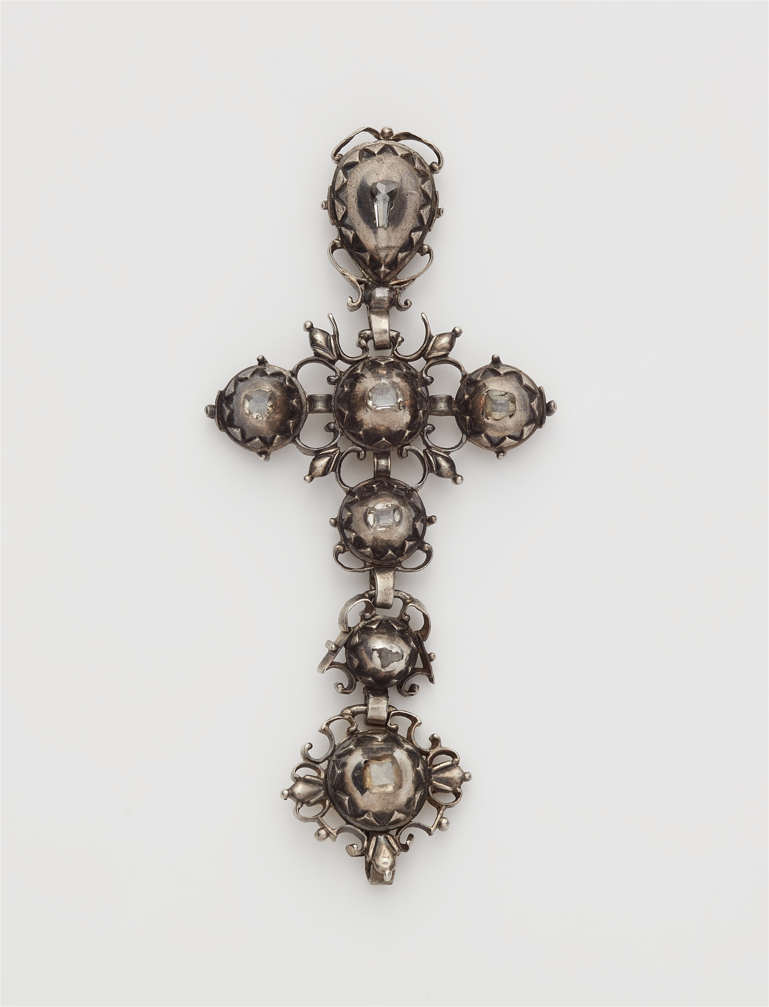 A Rococo silver gilded diamond multi part cross pendant.