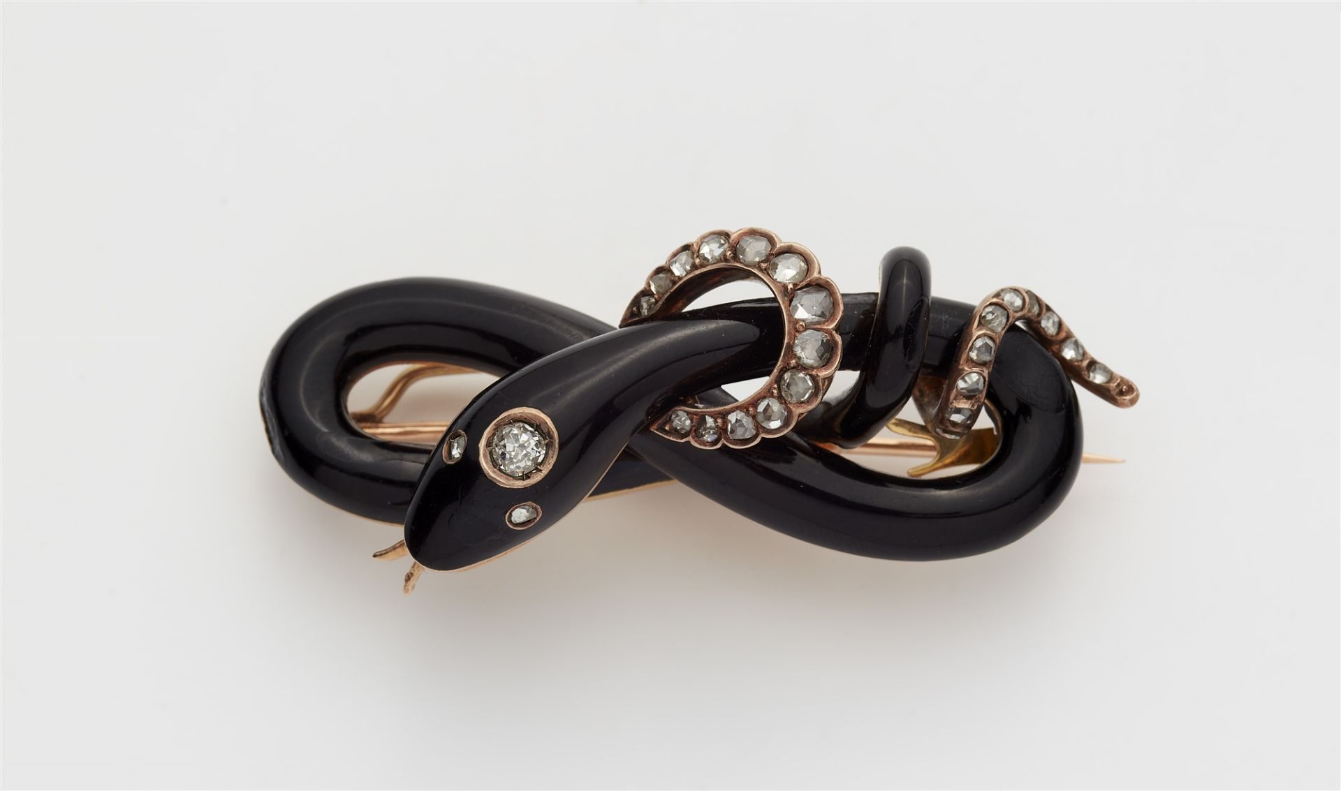 A late 19th century 14k gold black enamel and diamond snake brooch.