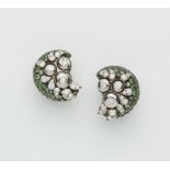 A pair of American 18k gold Sterling silver tsavorite and diamond clip earrings.