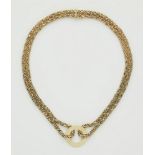 A German 14k gold cord necklace.