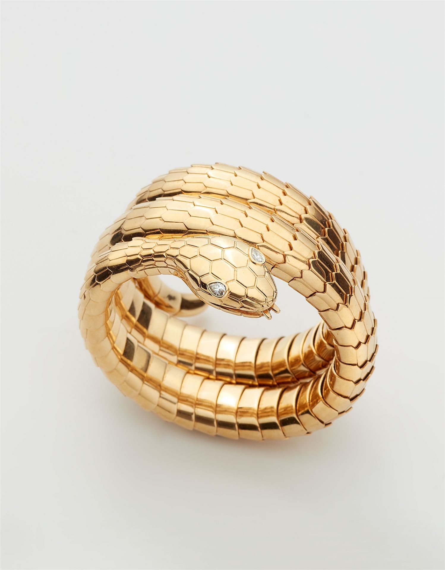 An Italian 18k gold and diamond tubogaz snake bangle.