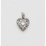 A Victorian silver 18k gold and diamond heart locket.