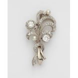 An Art Déco 14k gold platinum diamond and pearl spray brooch.