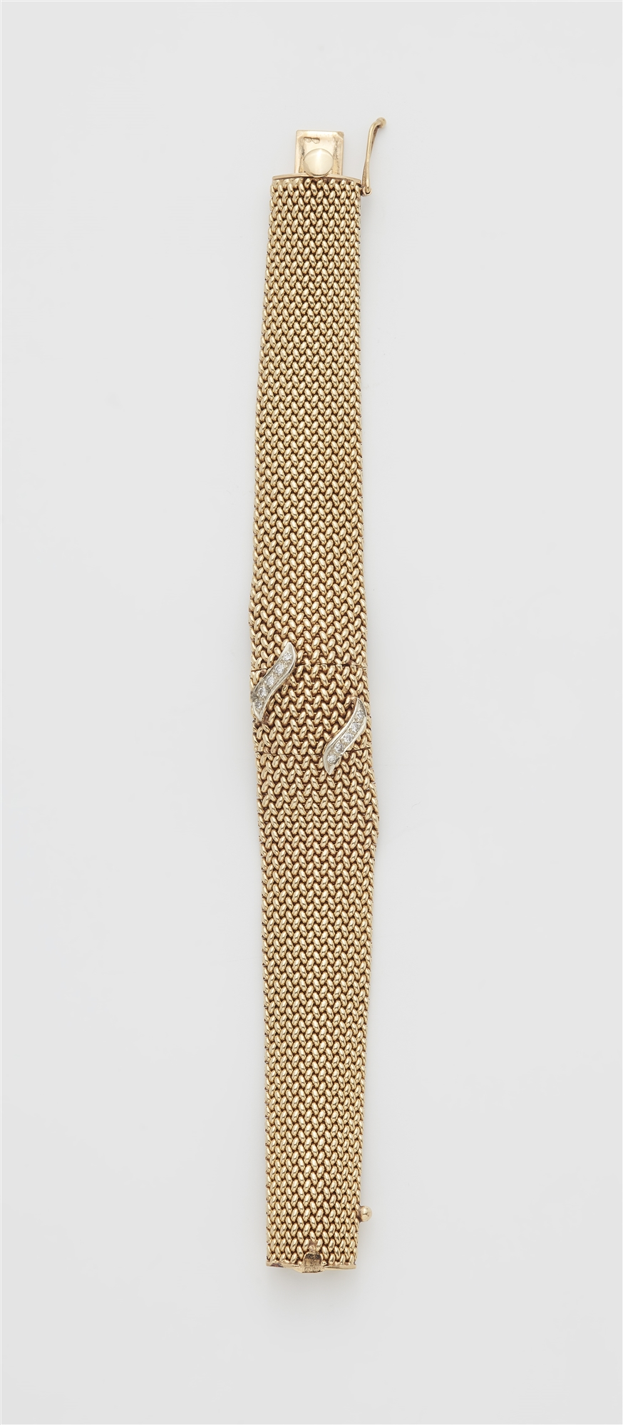 A 14k gold mesh and diamond bracelet with concealed Longines ladies watch.