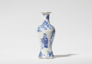 A small baluster-form faience vase with Chinoiserie decor