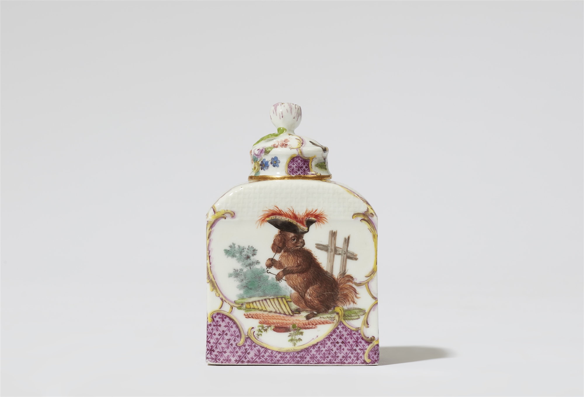 A Meissen porcelain tea caddy with a dog in a costume and poultry